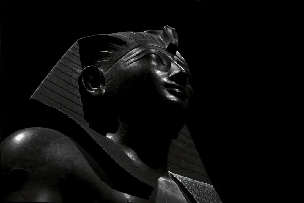 Image of a statue of Thutmose III, one of the formidable pharaohs of ancient Egypt, captured in stone.