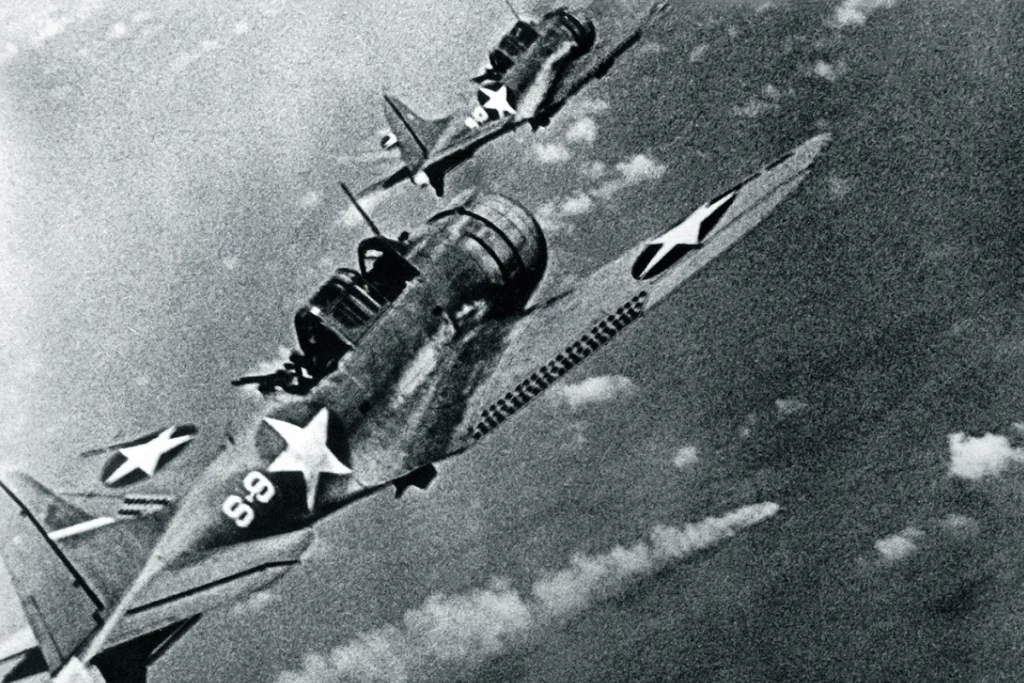 Image of two U.S. Navy dive bombers in action during the Battle of Midway, exemplifying pivotal moments in the modern history battles of World War II