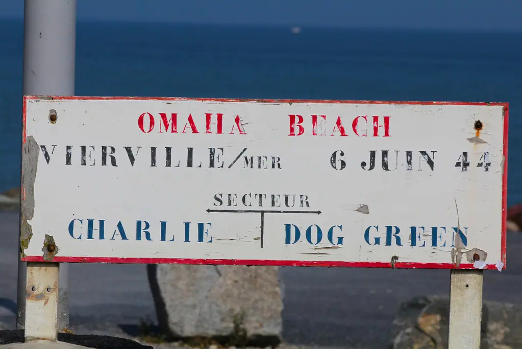 A sign marking Charlie and Dog Green beach sectors of Omaha Beach for an article covering 10 interesting facts about D-day.