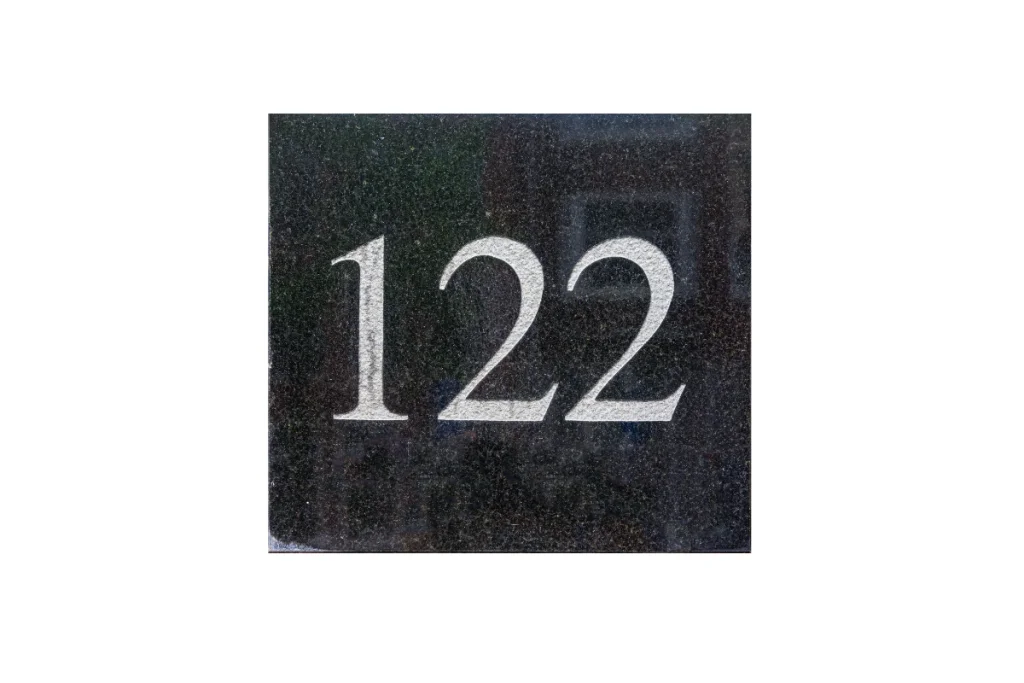 Image of the the number 122 in granite, representing the highest age reached by the world's oldest people.