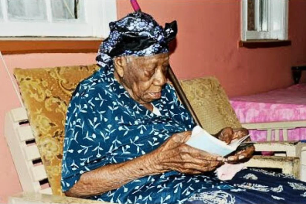 Image of Jamaican supercentenarian Violet Brown, reading.
