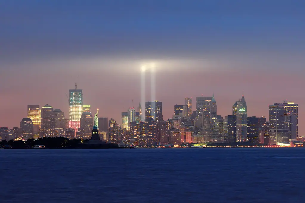 Image of two lights reaching skyward to commemorate the twin towers in New York for a blog post covering significant historical events.